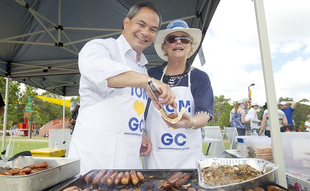 Gold Coast mayoral candidate Tom Tate serves up a sausage to launch his campaign.